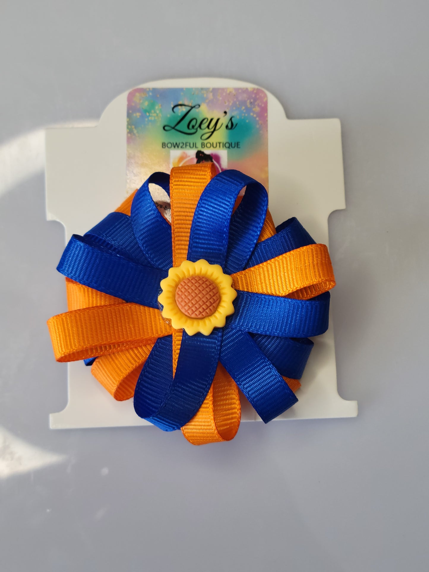 Blue and orange grossgrain flower bow